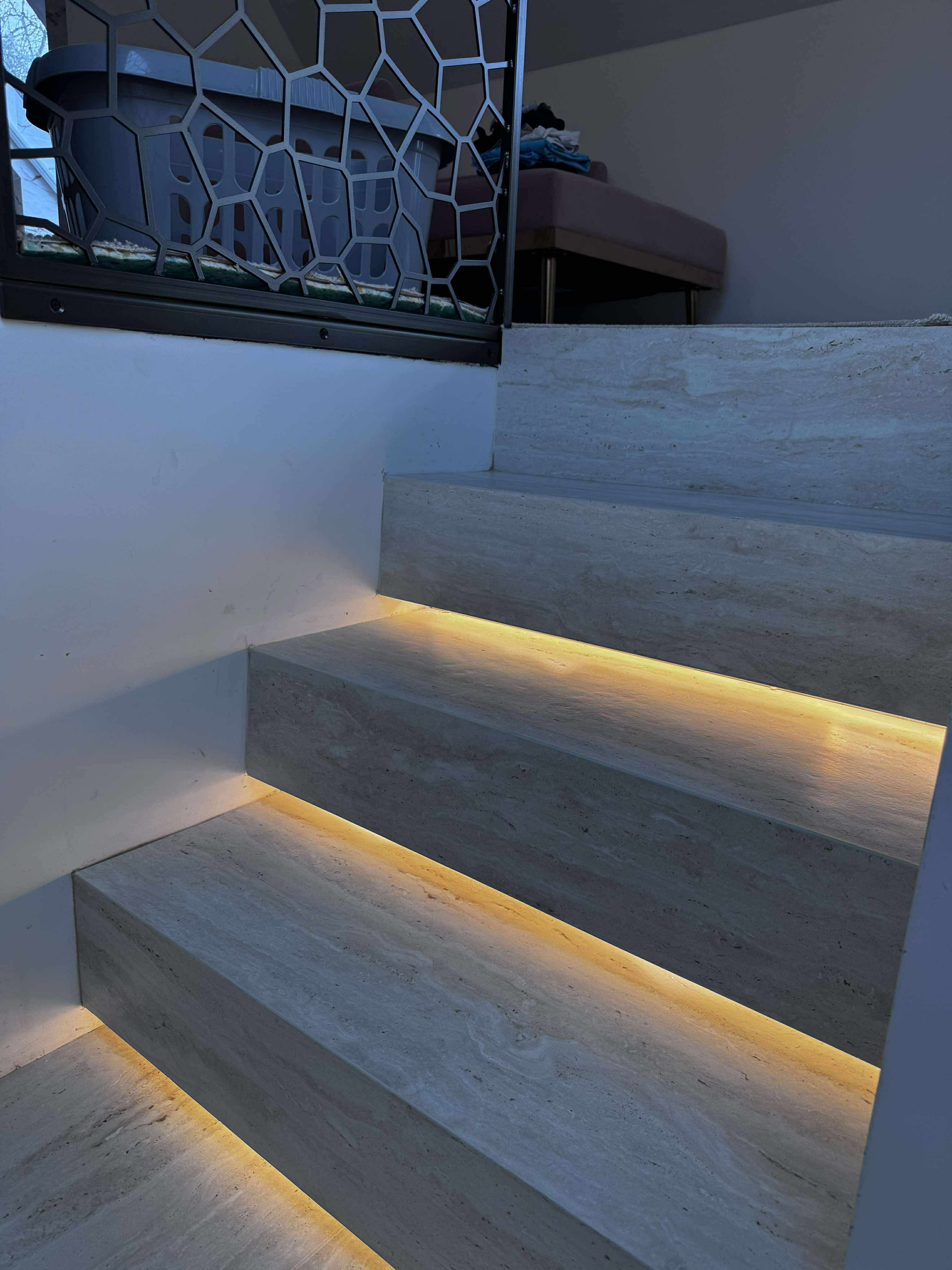 Detailed tiled stair corners with warm lighting