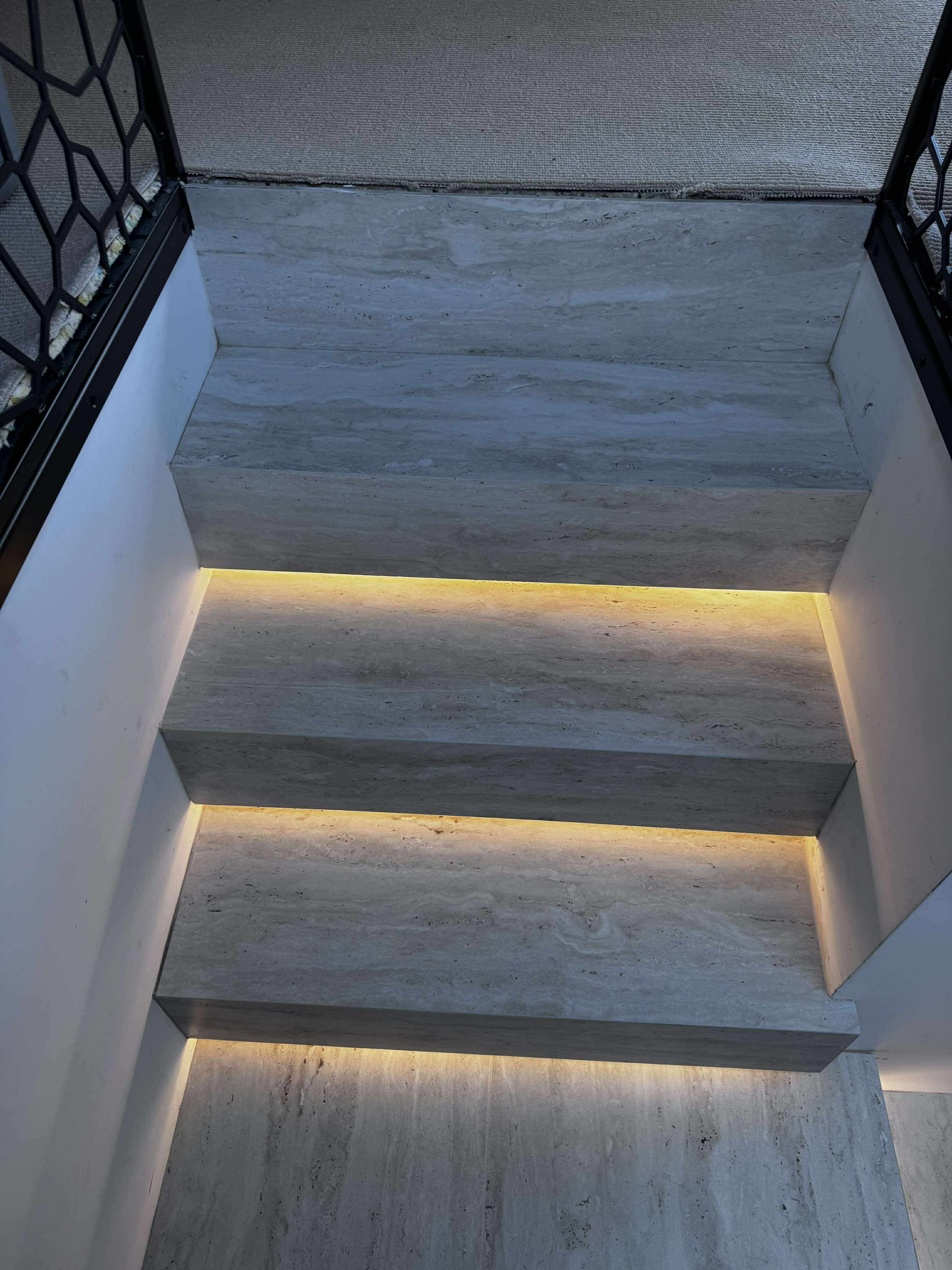 Floating tiled steps with integrated lighting