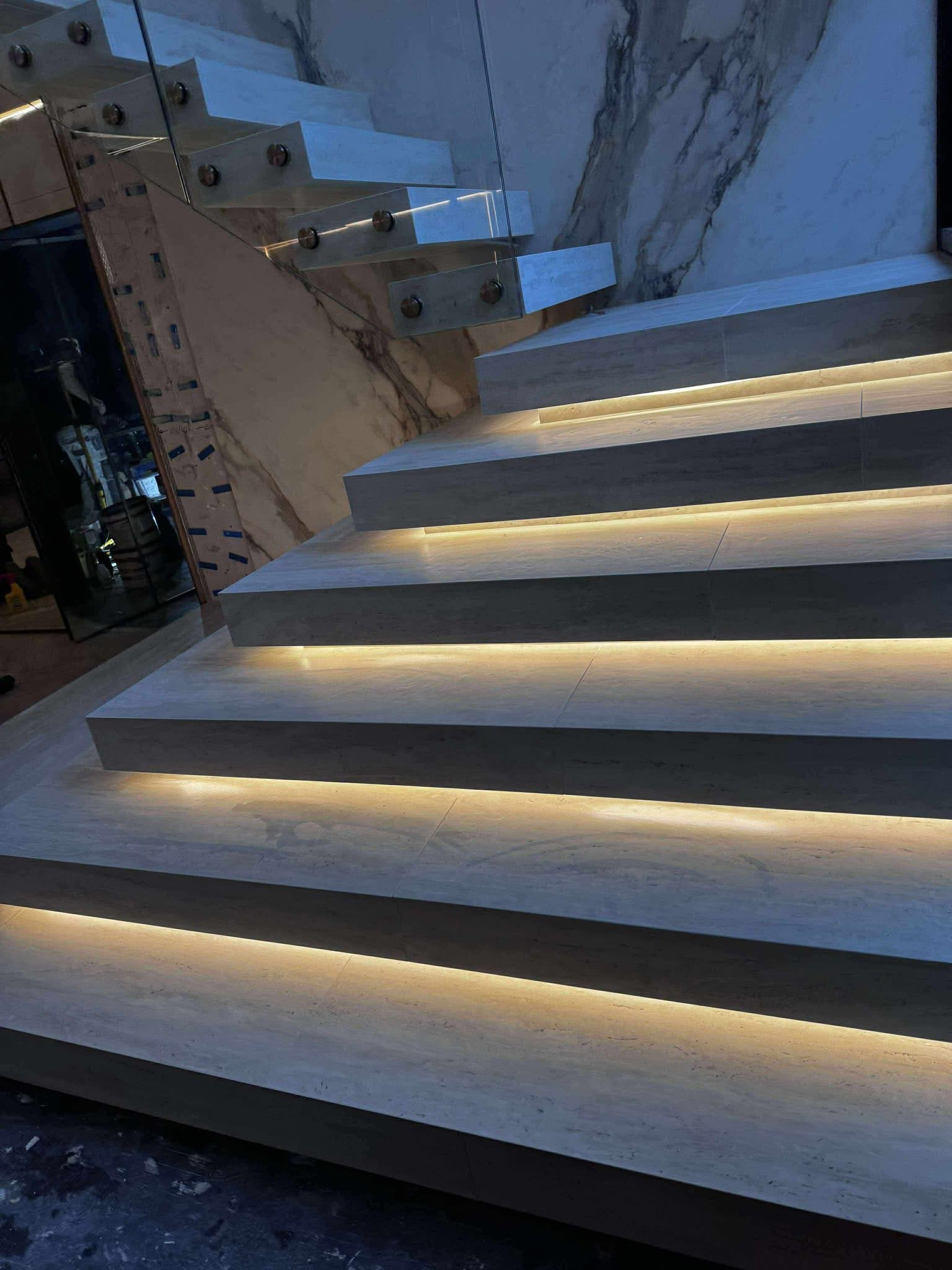 Finished porcelain staircase with feature lighting