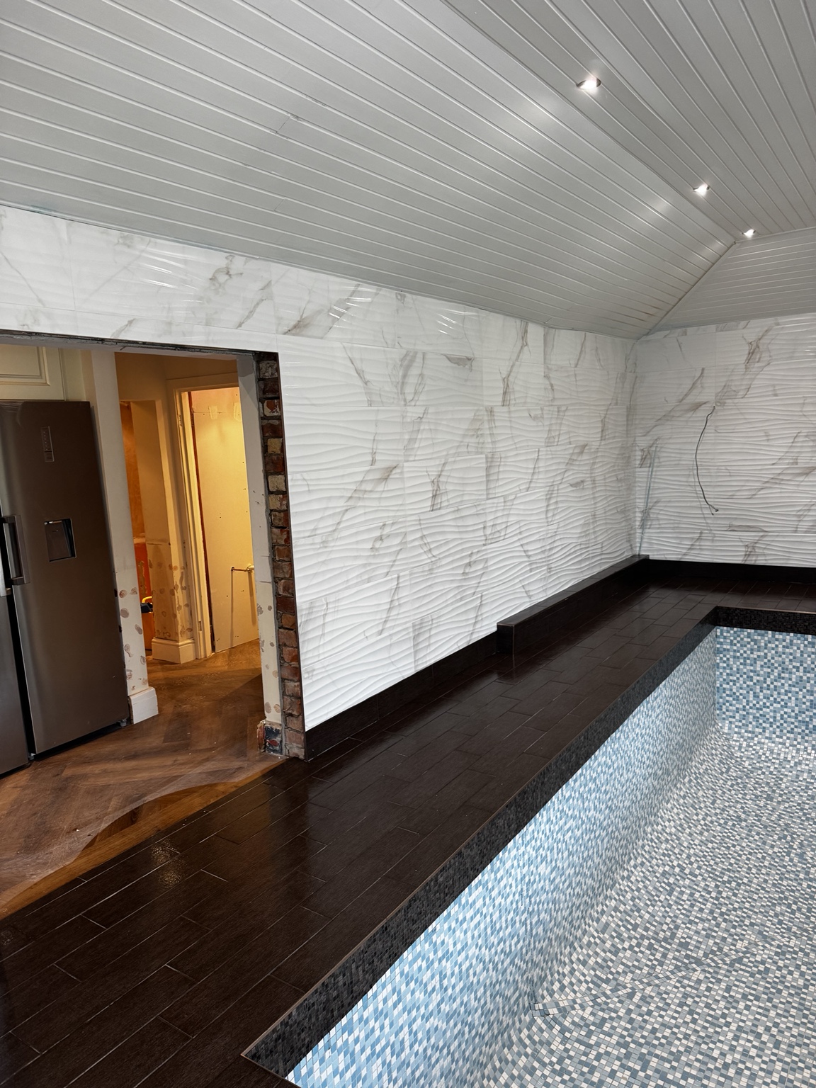 Finished swimming pool and porcelain surround